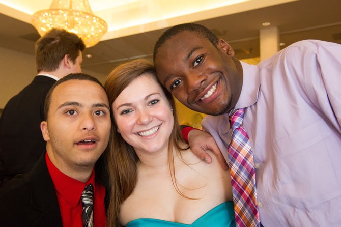 Fairfax High School students Sayed and Kendall dance with Lake Braddock senior Stephanie Masters at the May 9 “Day Prom” held at the Fair Oaks Waterford.
