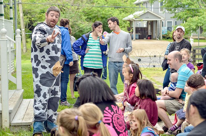 Steve Golobic (left), park employee at Colvin Run Mill Park, assisted at the children’s puppet show.
