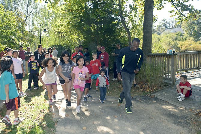 Participants, including two-time Olympian Moise Joseph, in the 2012 fun run.
