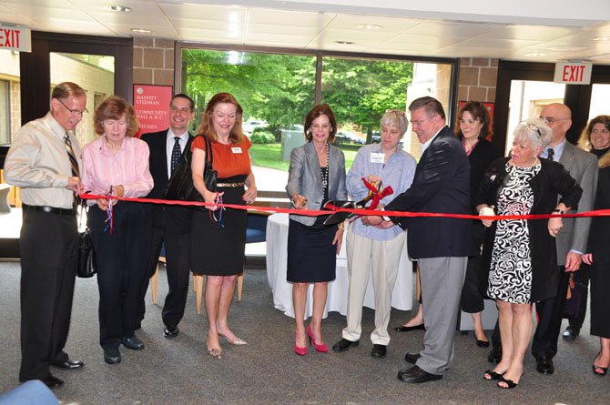 Local officials and volunteers cut the ribbon for the new McLean Senior Source help desk Wednesday, May 15. The service kicked off Tuesday, May 21.