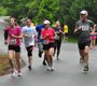 Runners make their way down Columbine Street, the ...