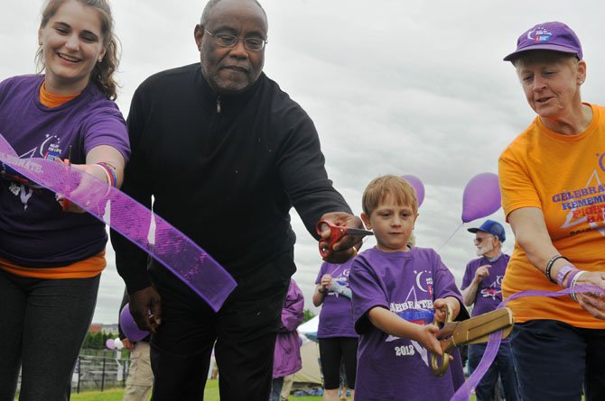 Brynne Ware-Colantuoni, Mayor Bill Euille, Jackson Dunton and Patty Moran are joined by elected officials and Relay for Life organizers in the official ribbon-cutting ceremony on Swanson field.


