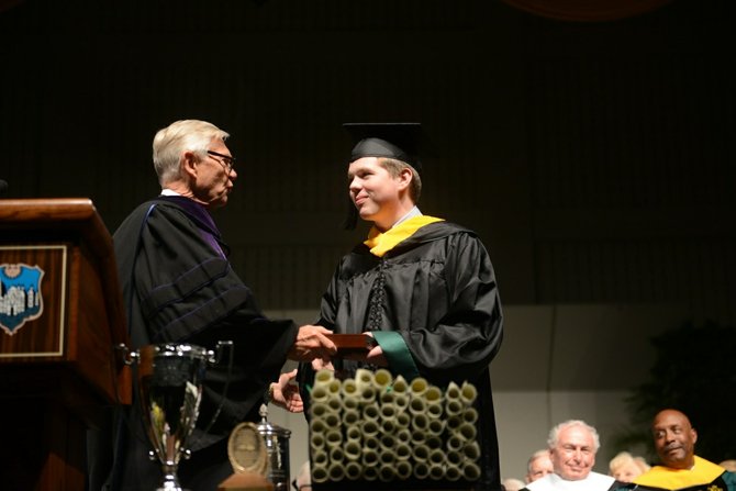 Brian Rabe, Class of ’13, receives W&M’s Botetourt Medal.