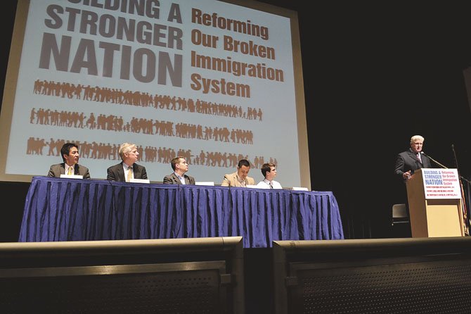Rep. Jim Moran, far right, speaks at a forum on immigration reform with members of the panel of to his right.