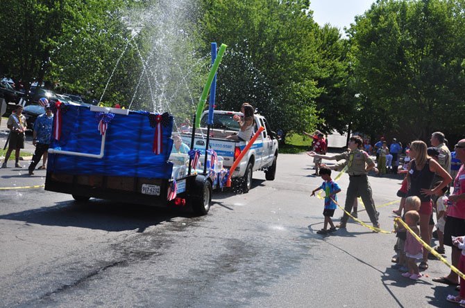 The H20 pools float cools down parade spectators during the annual Great Falls Fourth of July parade last year. 