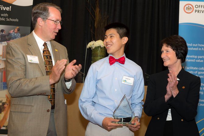 Kevin Cao, a senior at Thomas Jefferson High School, receives the Tony Griffin Partnership Leader award at the 2013 Celebrate Partnerships Award Ceremony on May 21 at the Mason Inn and Conference Center. Former County Executive Tony Griffin and Sharon Bulova, chairman of the Fairfax County Board of Supervisors, applaud Cao’s initiative in co-founding GIVE, Growth and Inspiration through Volunteering and Education, a tutoring program.