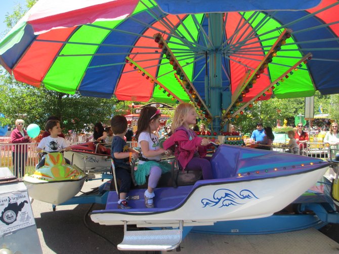 The "boats," bobbing over imaginary waves, brought smiles to the young riders. 