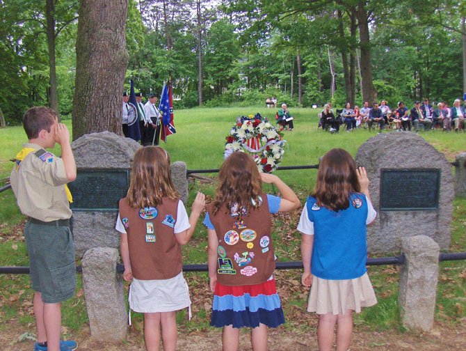 Scouts salute the monuments of Generals Isaac Stevens and Philip Kearny in Ox Hill Battlefield Park.