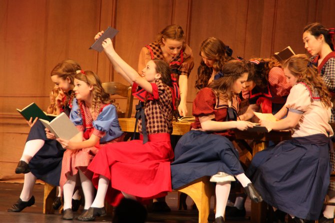 South County High School's cast of “The Music Man” performs. Actors are, from left, Lindsey Otto, Marin Tettelbach, Katelyn Sparks, Rachel Epstein and Samantha Hamilton; and, back row, from left, Darby Glackin, Emmy Brien, Kelsey Davis and Kathy Oh.