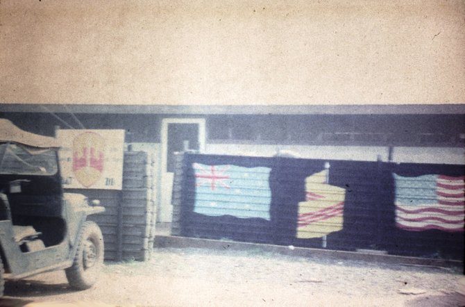 The compound’s fence was decorated with assorted flags.