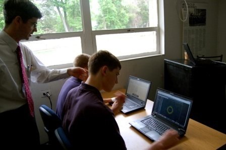Trinity School teacher Tim Maloney, Daniel Rice and Jonathan Young analyze particle data at Cern in Geneva, Switzerland. 