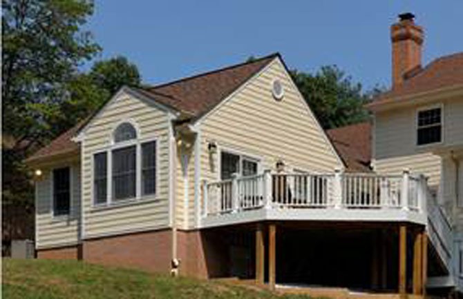 The addition of a main-level master suite with easy access to outdoor living space paves the way for aging in place and family entertaining.