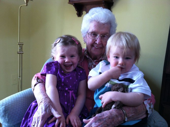 Dot Brown, 96, holds two of her great-grandchildren, Harper and Eamon. Mental health experts say that strong familial relationships contribute to one’s overall sense of well-being.