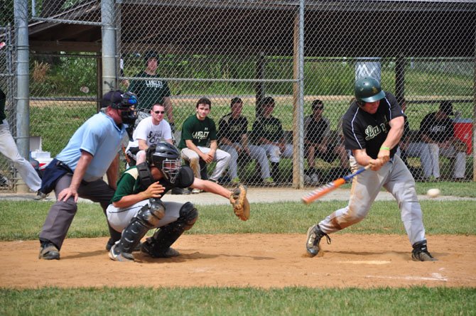 Eddie Gonzalez, playing for the Langley Alumni team, bats against the Langley varsity Sunday, June 2. Gonzalez hit a two-run home run in the alumni team’s 11-2 win. 