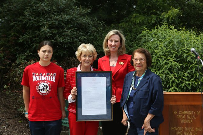 Del. Barbara Comstock (R-34), third from left, presents a resolution to Tony Blankley’s daughter Anna, his wife Linda Davis and her mother. 