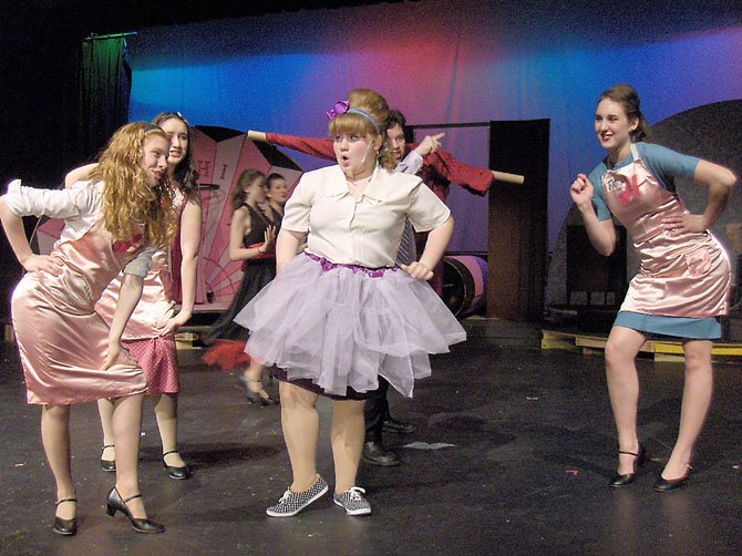 From left) Rachel Ingle, Mady Hanton, Hannah Sikora and Katie Mahon-Kuzin rehearse a number from Robinson’s “Hairspray.”