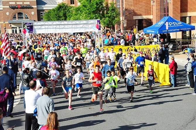 The race starting line at the "Ringing in Hope: A Salute to Our Troops" 5K, 10K and 1K. Matthew Clark, of Reston, won the 5K Memorial Day race. 