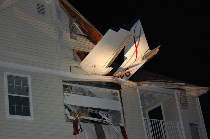 The nose of the plane came to rest on the living room floor of a third-story apartment.