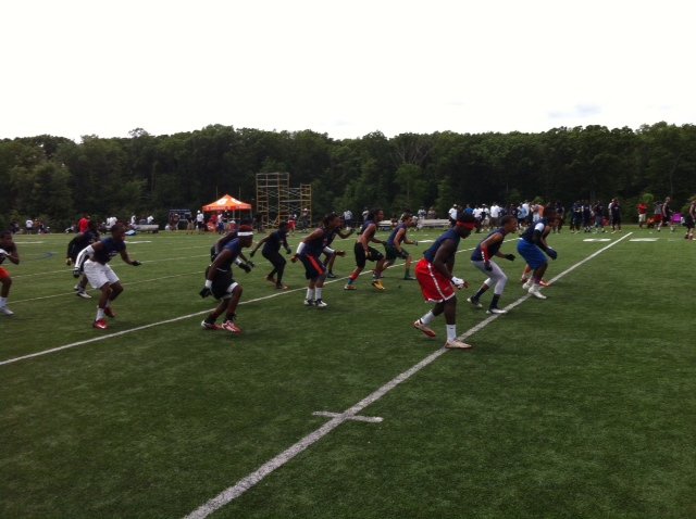 The cornerbacks practice their footwork during specific position instruction.