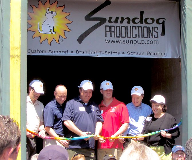 Founder CAS Shiver leading a ribbon cutting for Sundog's grand opening on Jermantown.