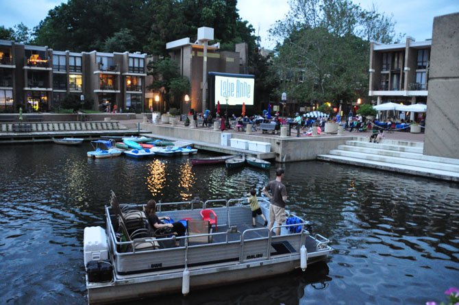 Boats pull up to Lake Anne Plaza to watch “Back to the Future,” the first film in the Lake Anne summer film series Sunday, June 9. 