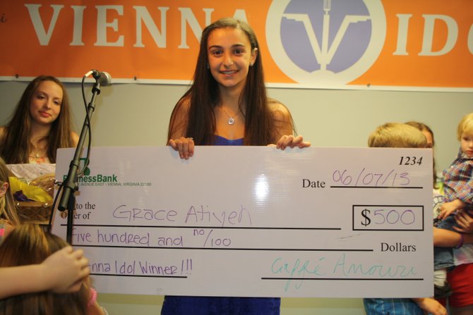 2013 Vienna Idol Grace Atiyeh accepts her $500 prize. She sang “Somewhere Over the Rainbow” to advance to the final round where she sang “I Will Always Love You.”