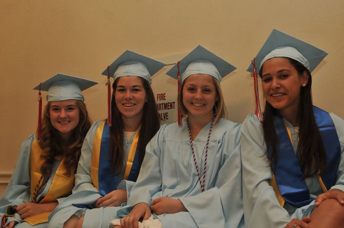 Rebecca Toser, Ashley Asta, Katherine Clark and Alexandra Sandlin celebrate Marshall High School’s graduation Friday, June 14.