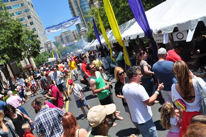 Crowds line up to try the vendors at the Taste of Reston Saturday, June 15, 2013 at Reston Town Center. 