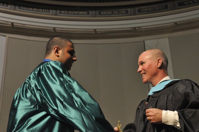 Fred Amico congratulates 2013 Faculty Award recipient Cameron Charles Ayoub at Langley High School graduation ceremony last Thursday morning, June 13.