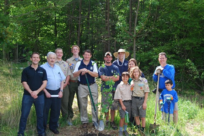 Del. Dave Albo (R-42), Supervisor Pat Herrity (R-Springfield), scouts from Troop 1140, South Run Regency community members, Fairfax County Park Authority representatives and a 95 Express Lanes project representative stand near one of 10 trees installed at Burke Lake Park near the South Run Regency community.