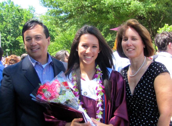 Allison Datoc stands with her family after the graduation ceremony.