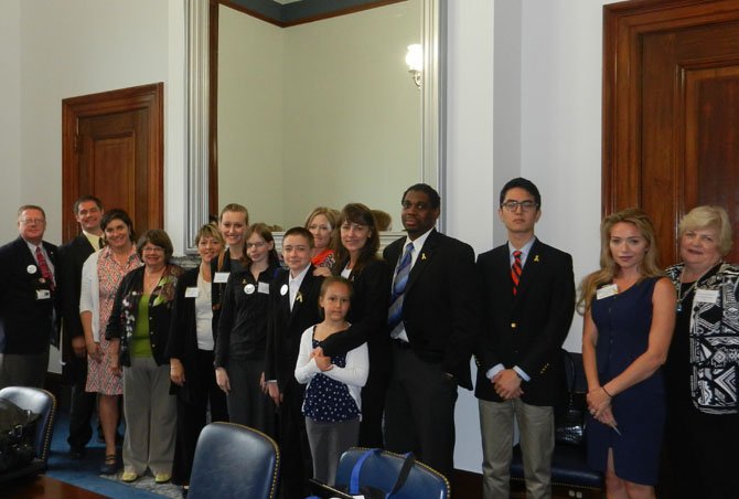 On Capitol Hill: Meg Crossett (fifth from left) with U.S. Sen. Tim Kaine’s aide, Russel Wade, and Virginia families who have children with cancer, who’ve lost them to the disease or are survivors.
