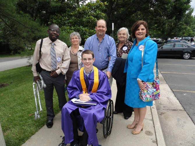 Nurse's aide Saint Kankam, grandmother Nadine Balenger, dad Steve Balenger, grandmother Rejane Quirion, and mom Sylvie Balenger with Nick Balenger (front row) after Lake Braddock's graduation ceremony at the GMU Patriot Center. 