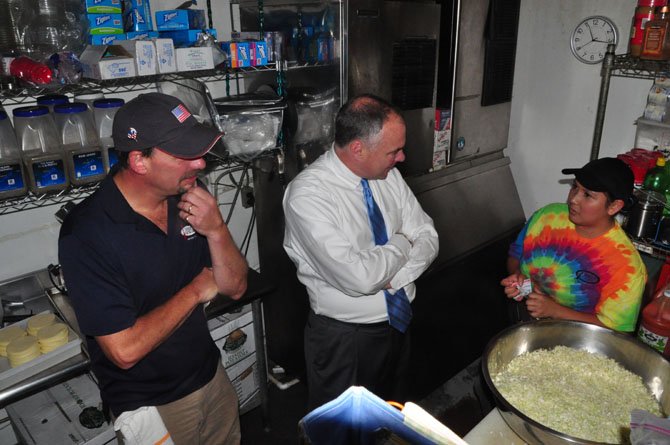 From left, Jimmy Cirrito, owner of Jimmy’s Old Town Tavern, Sen. Tim Kaine (D) and Jimmy’s staff member Flora Benivedes. Benivedes is a recent hire to Jimmy’s, having recently been granted permission to work by the DREAM Act. 