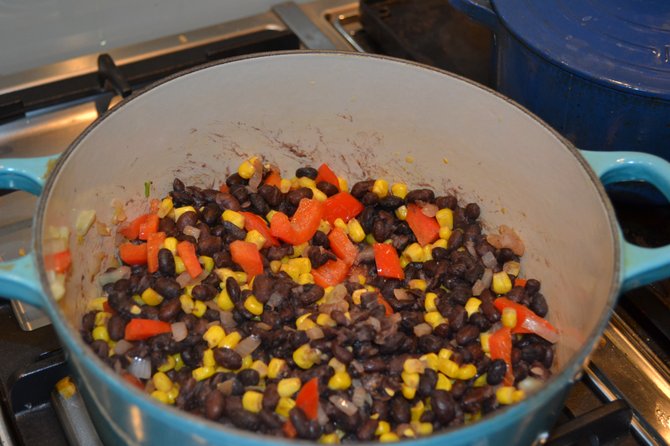 A recent study showed that vegan and vegetarian meals, such as this corn, red pepper and black bean dish can help prolong one’s life.