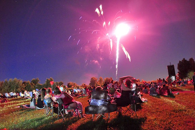 Visitors to Turner Farm watch the annual Fourth of July Fireworks show.