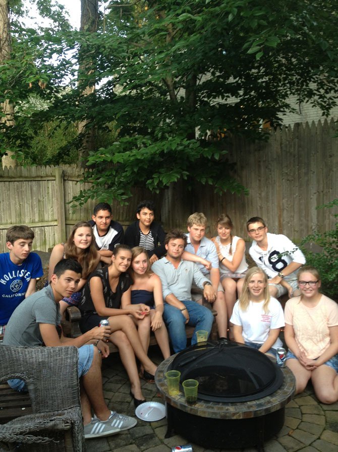 Americans students Carlos Ferrufino, Raymond Tunon, Alyona Brooker and Shanley Kirk say “au revoir” to their French peers Baptiste Pimont, Juliette Gauchard, Anne-Cecile Leconte, Pierre Berceron, Jean Blazec, Paul Lefevre, Pierre Salvi, Lise Mourtier, and Mathilde Tremen at a farewell BBQ held Saturday, July 6. Kirk, Tunon, and Brooker will travel to Normandy and the French sister city of Caen for a two-week stay beginning July 11. 