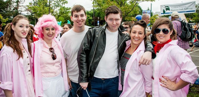 Pink Ladies and two boys: From left are Madalyn Farmer, Caty Nicholson, Daniel Perkes, Gavin Cole, Kristina Ortiz and Emily Ranch in costume at the City of Fairfax Fourth of July Parade.