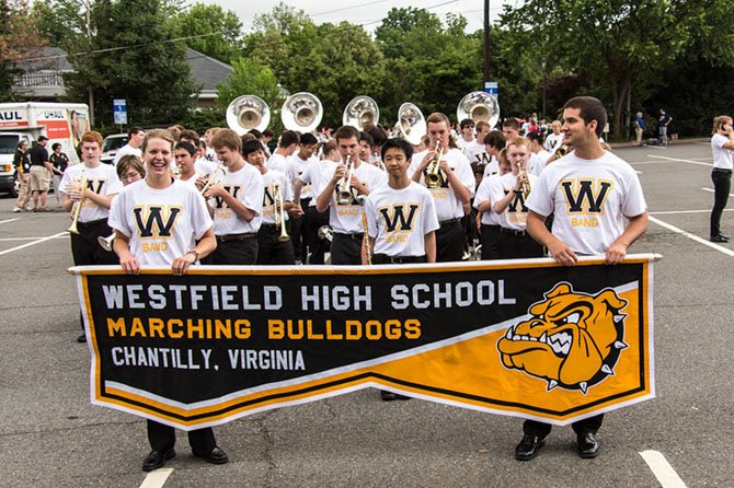 Morgan Tweddle (left) and Andrew Banick lead Westfield High’s Marching Band at the City of Fairfax Fourth of July Parade.