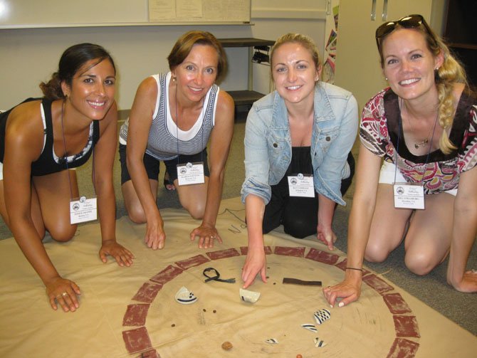 Teachers from Reston-Herndon area participating in a simulated archeological dig as a part of the Discovering the Past Session: From left—Poneh Aranee, Karen Stevens, Kat Goodale and Meg Strasburg.