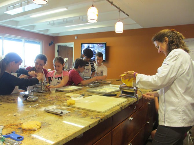 Culinaria campers take instruction from Chef Marilena Leavitt, classical chef.