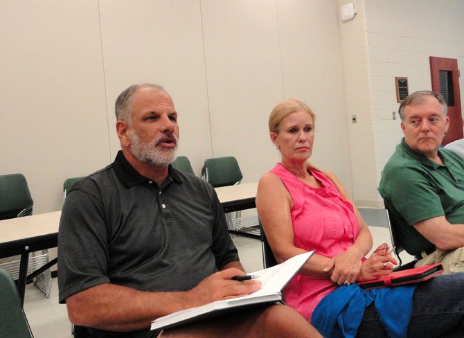 Ted Troscianecki (on far left) makes a point while his wife Tami and Sully District Planning Commissioner John Litzenberger listen.