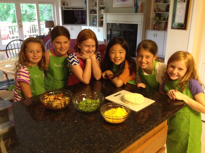 From left: Katie King, Sasha Fedorchak, Lucy Rogers, Eliza Grace Ulmer, Haley King and Grace Griffin prepare to cook in Arlington, Va. Local culinary enthusiasts say there are an abundance of healthy summer treats that can be made at home.