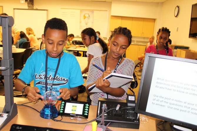 Students study electricity and record their observations like scientists during the VISTA camp.