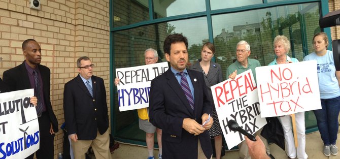 Sen. Adam Ebbin (D-30) and Del. Scott Surovell (D-44) appear at the Alexandria Department of Motor Vehicles to announce their intention to introduce legislation repealing the tax on hybrid vehicles.