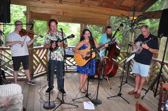 Members of the Rogue Farmers perform at a fundraiser for the McLean Orchestra Sunday, July 21. 