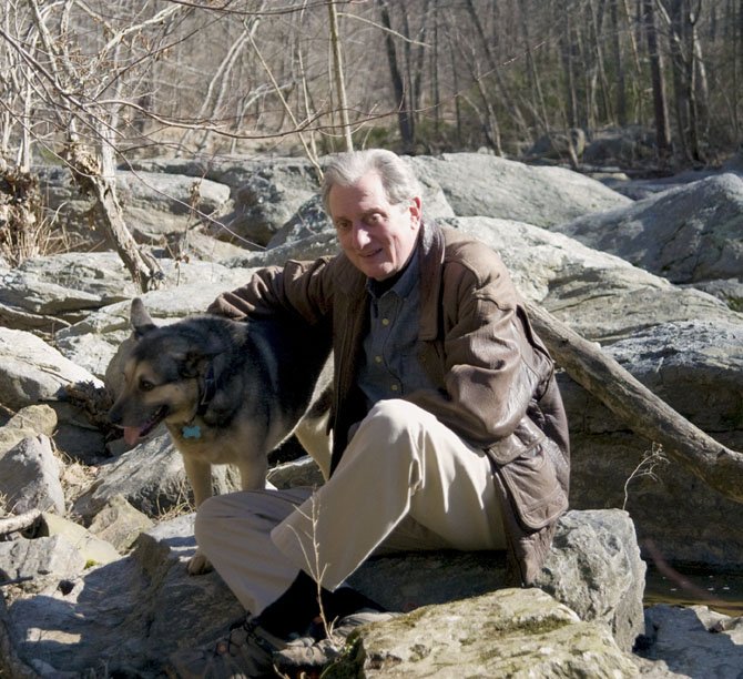 Great Falls resident John Dibble and his dog Noochie. Dibble has written his first novel, "Difficult Run," which is set in Great Falls Park. 