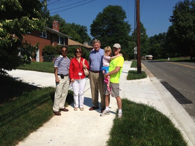 Mohammed Kadasi, County Capital Facilities Department, Shahla Zahirieh, County Department of Transportation, Supervisor John Foust and Knut Ryerson and daughter dedicate the new walkway on July 18.
