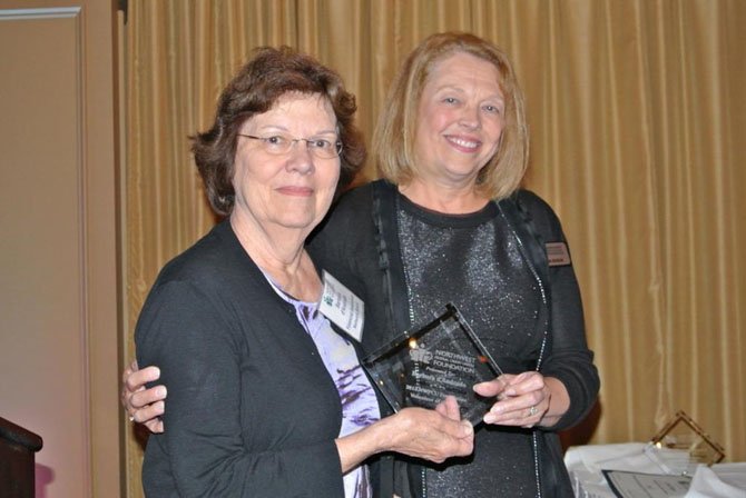 Linda Rogus, executive director of NWFCU Foundation (right), presents Barbara d’Andrade with the 2013 Volunteer of the Year award. D’Andrade lives in Vienna and has been an active foundation volunteer for several years.