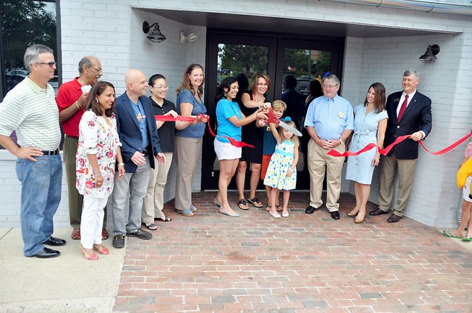 Herndon officials and members of the business community cut the ribbon on the Mellow Mushroom Monday, July 22. 